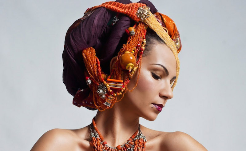 Moroccan singer / songwriter Oum wearing one of her elaborate head wraps.